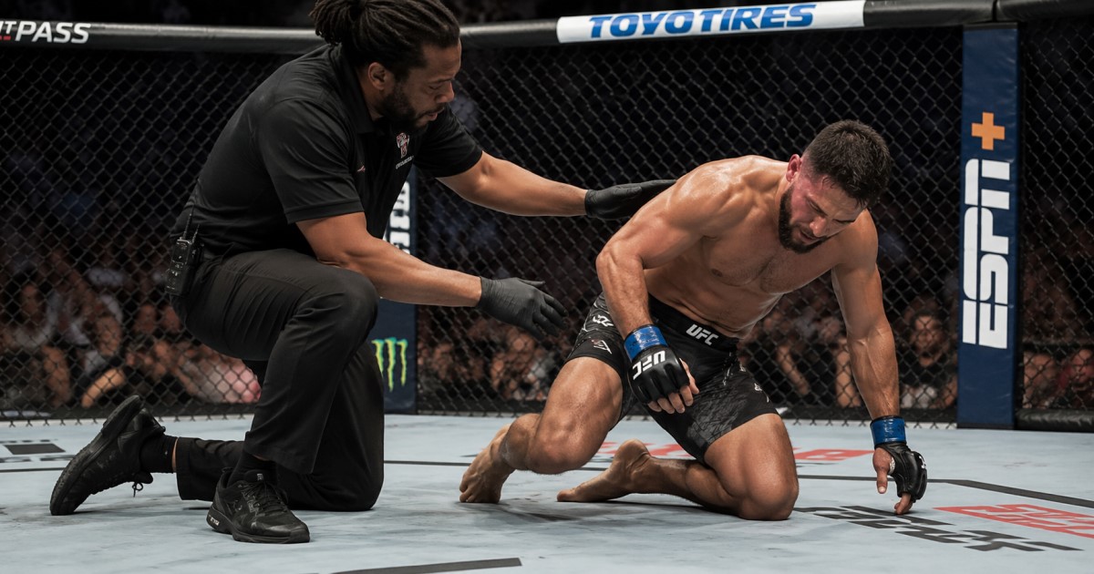 Realistic ringside sports medicine scene showing a referee stopping a combat sports bout after a head strike.